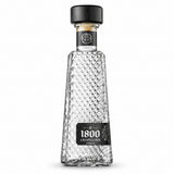 Clear glass bottle with diamond pattern and black cap on a white background