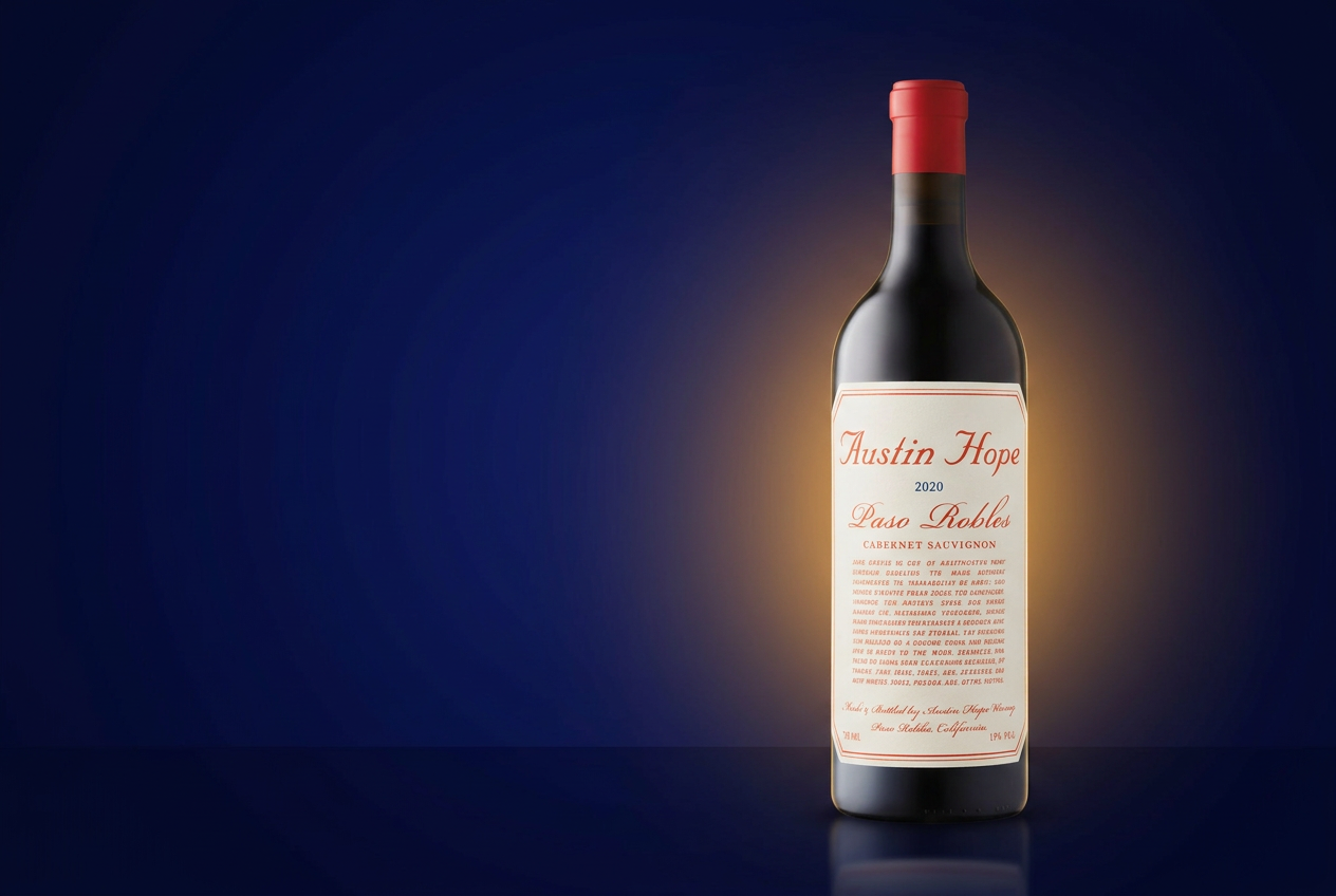 Austin Hope Paso Robles Cabernet Sauvignon bottle on a navy background with warm amber light